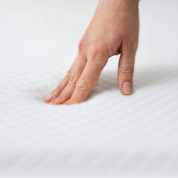 finger against memory foam